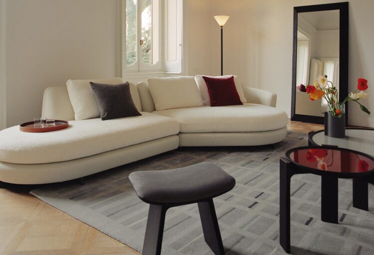 Duo Table with red top in living room with other Poltrona Frau furniture