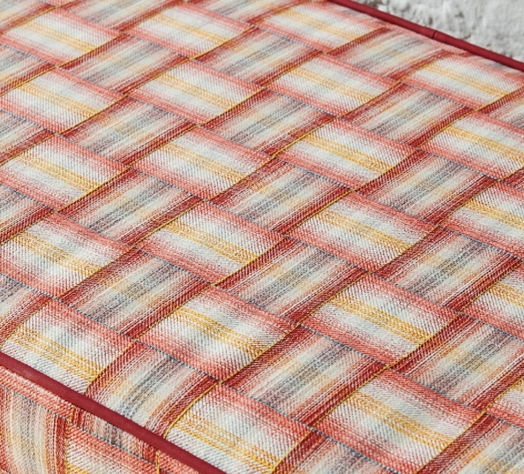 Lawn chair in red/yellow/pink colorway. Detail.