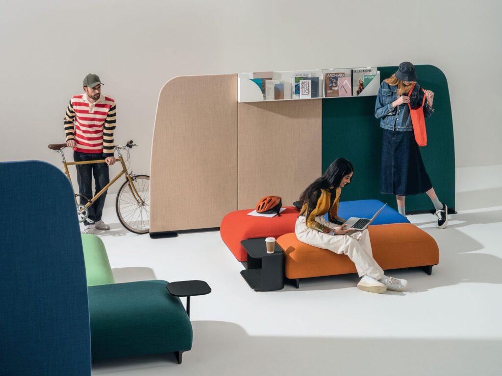 Office scene with partition, bench, and seating with three hip people