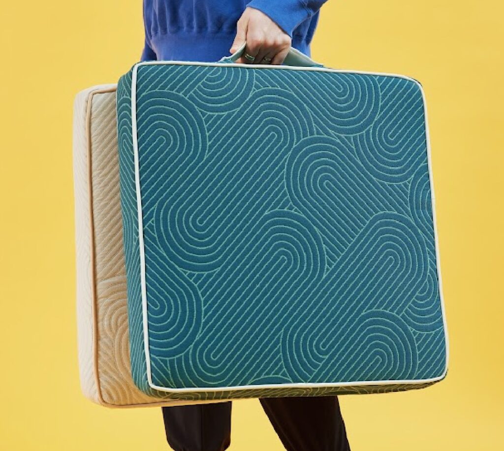 Ms. Quilty detail on cushions in sea green and yellow