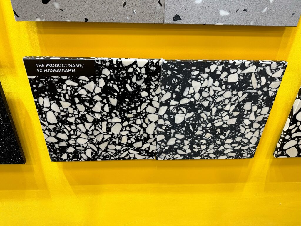 Recycled marble with black background and white pieces
