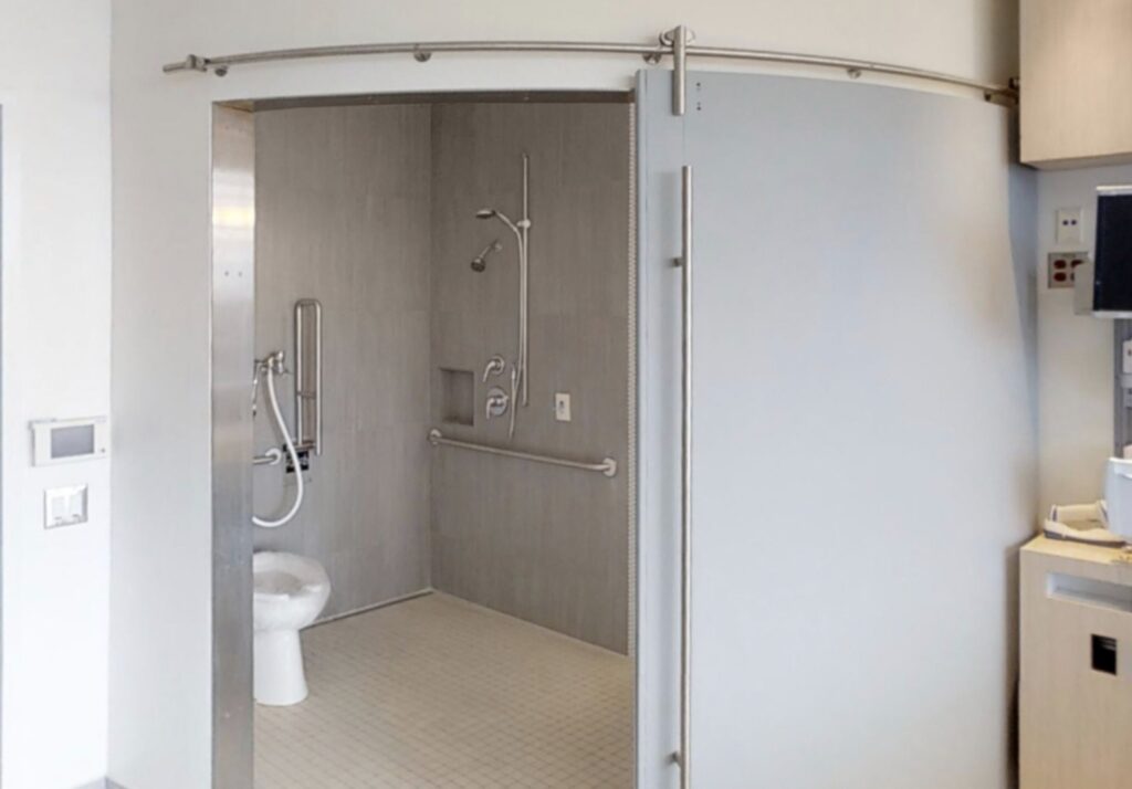 Curved Acrovyn door in healthcare setting