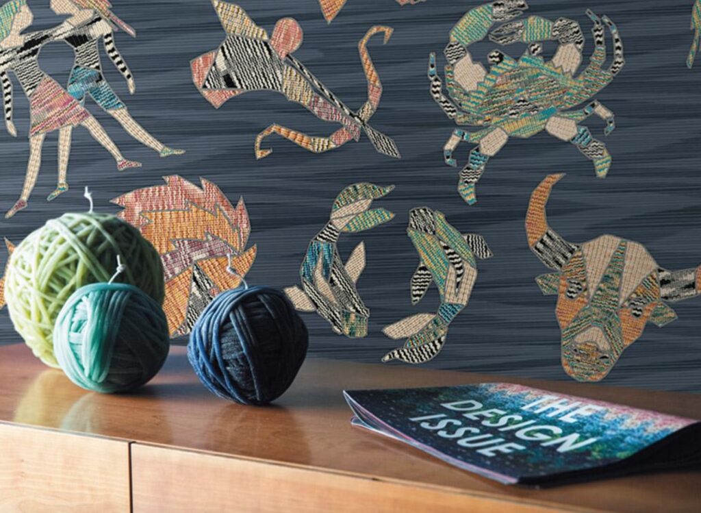 Constellations with blue backing and console with balls of yarn in the foreground