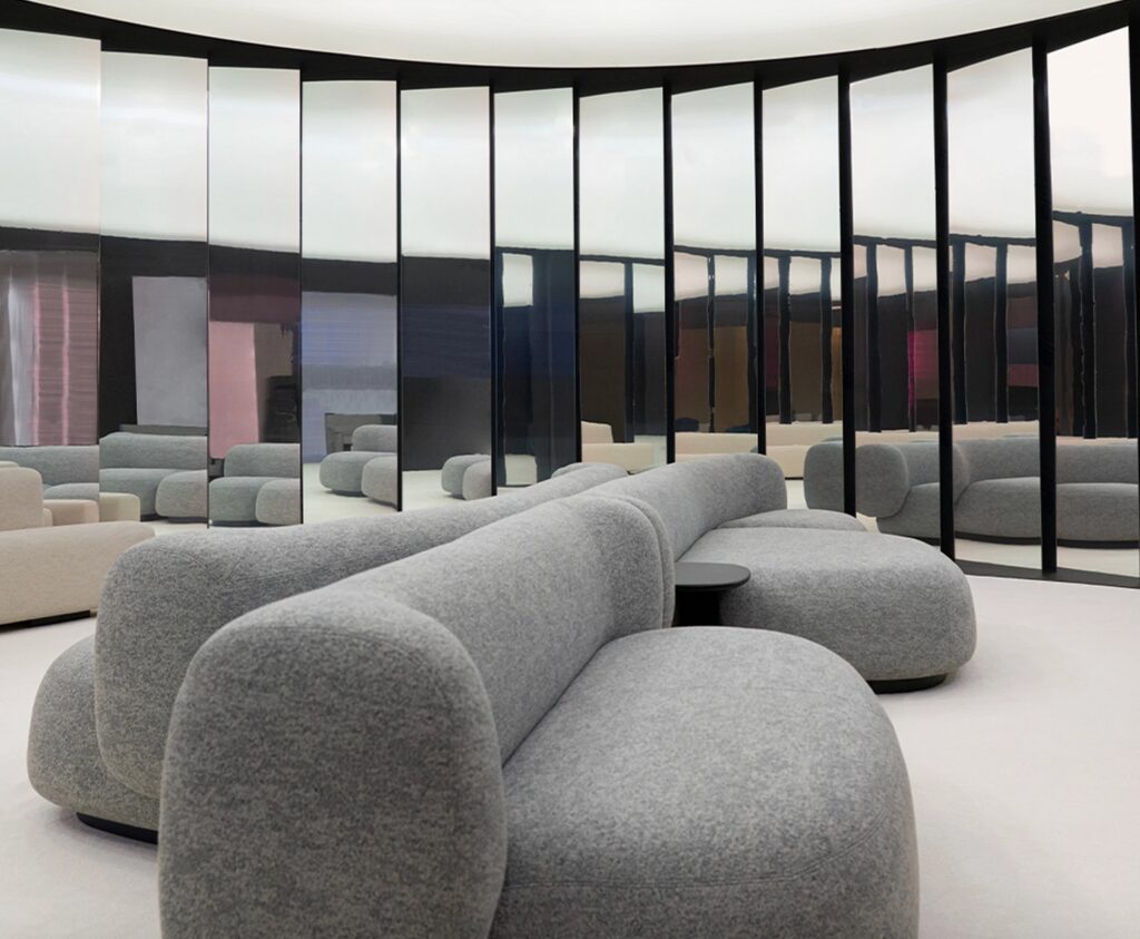 Light gray sofa in mirrored room