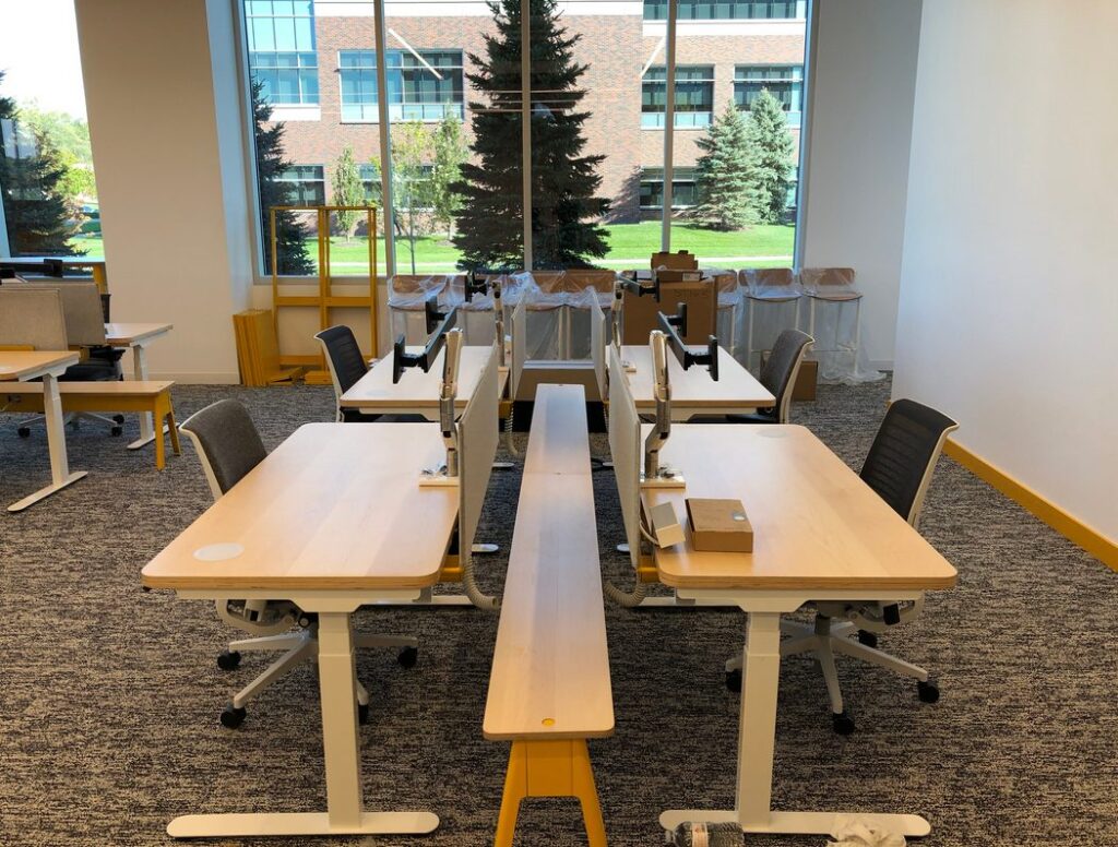 View of matching workstations with wooden power beam