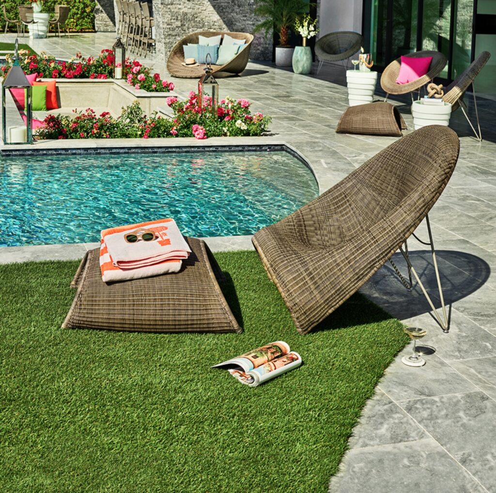 Fibonacci lounge chair with ottoman poolside with magazines