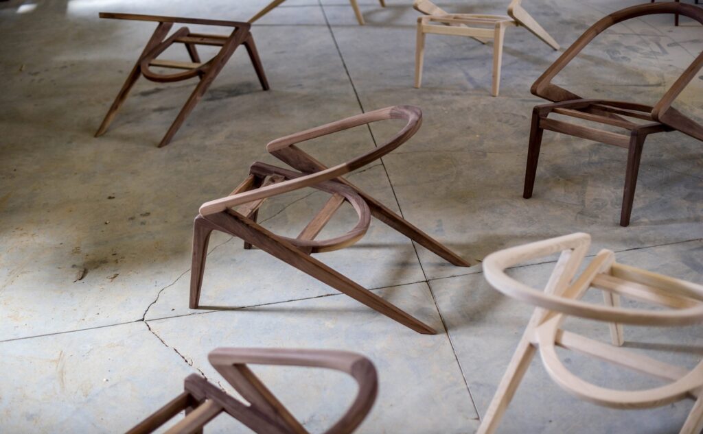Lounge chairs in walnut and ash sans upholstery