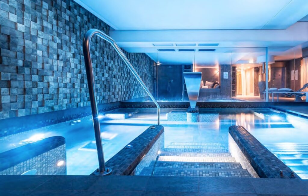 Feature wall at a spa next to a pool in France