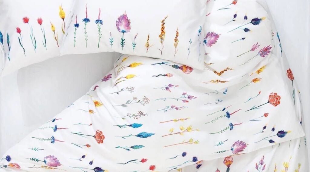 Textile design with delicate flowers on a white background