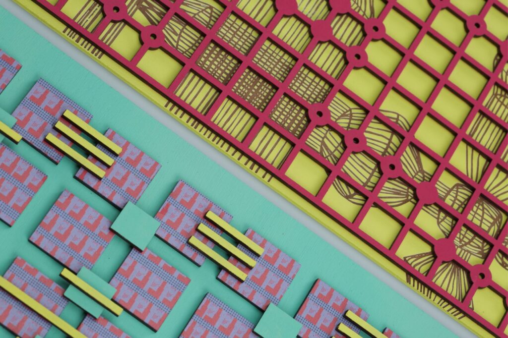 laser-cut rigid material overlayed on decorative print images