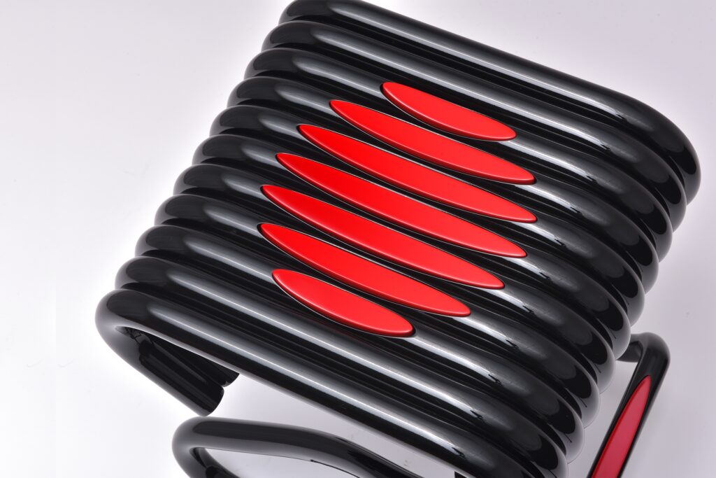 Stool in black with red design on top