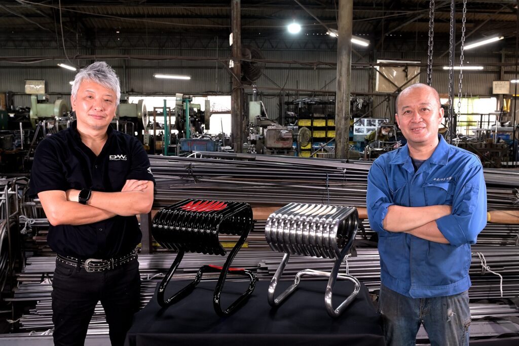 The designers in factory with stools