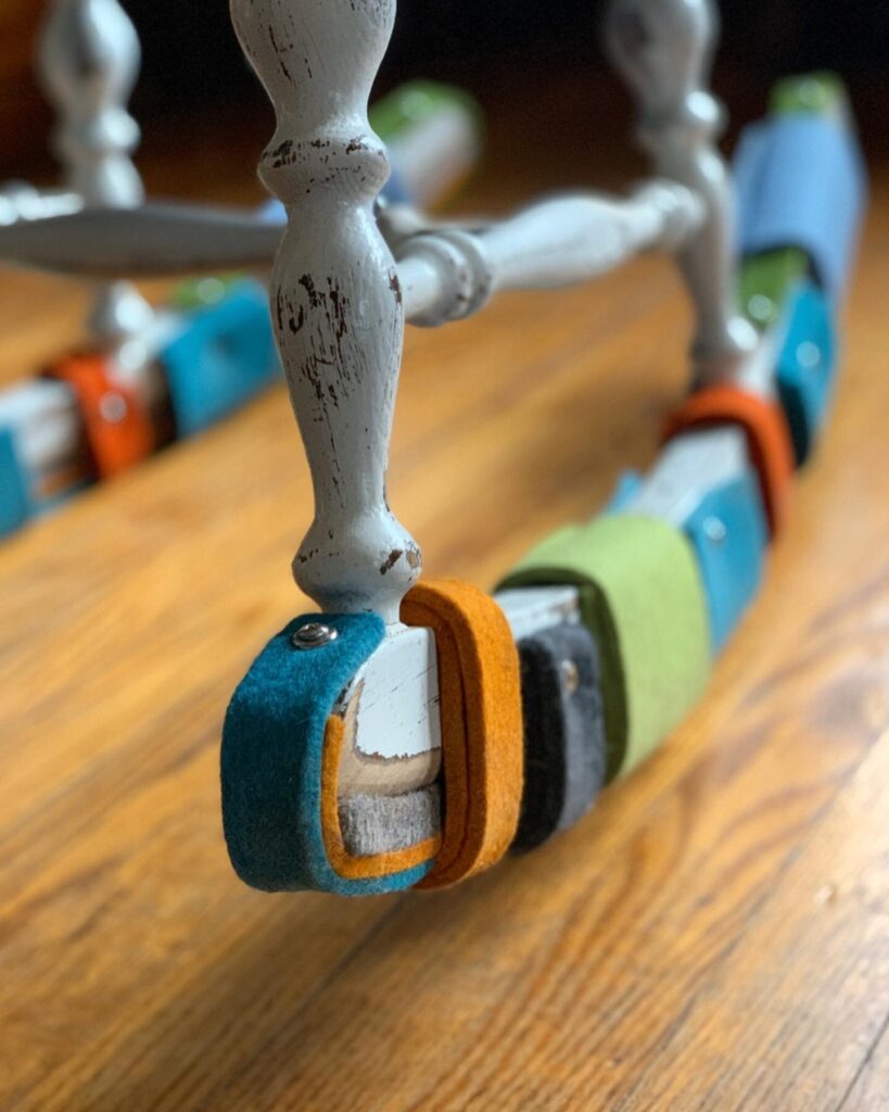 Rocking chair detail of rail with colorful felt