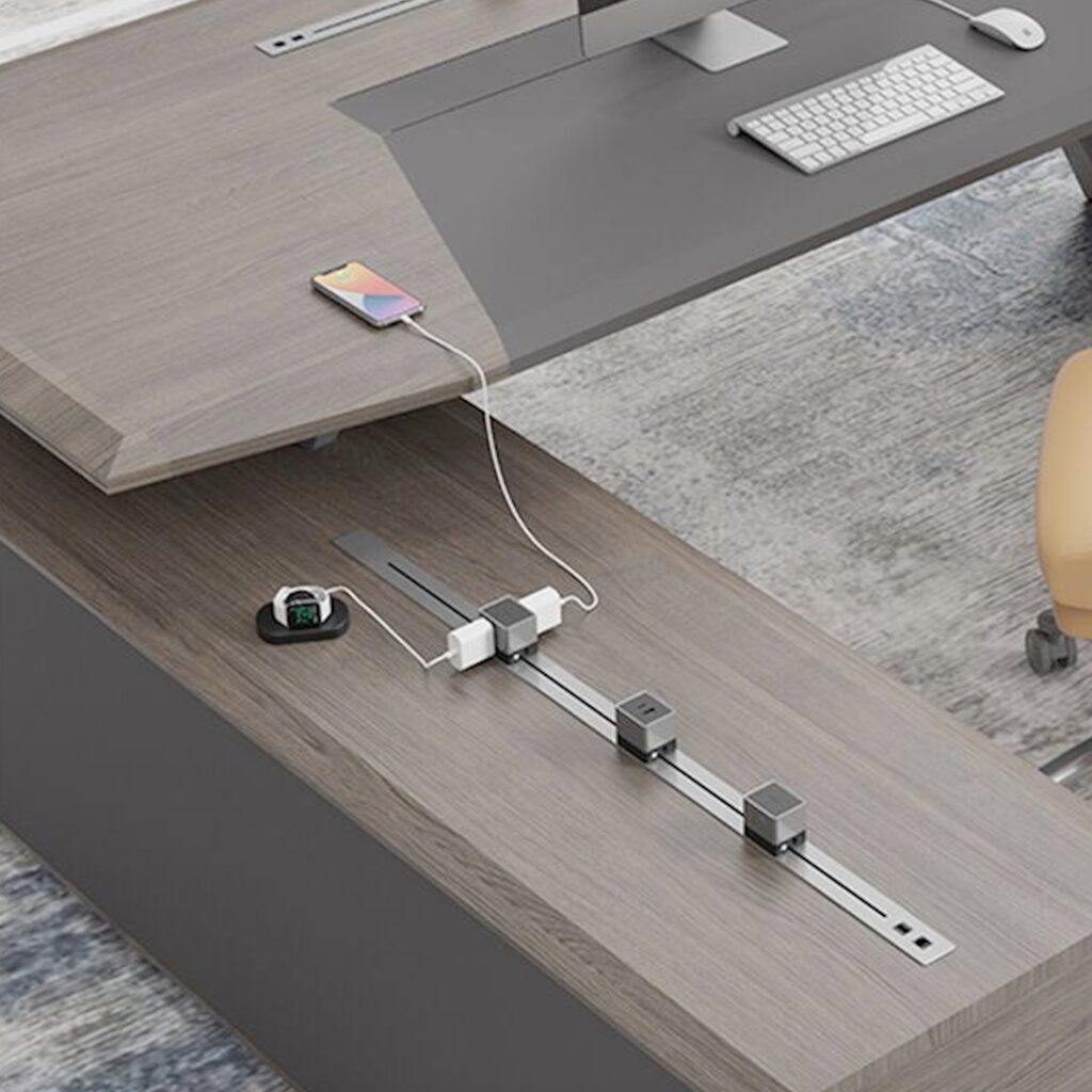 Line Series on pedestal of table with three charging modules