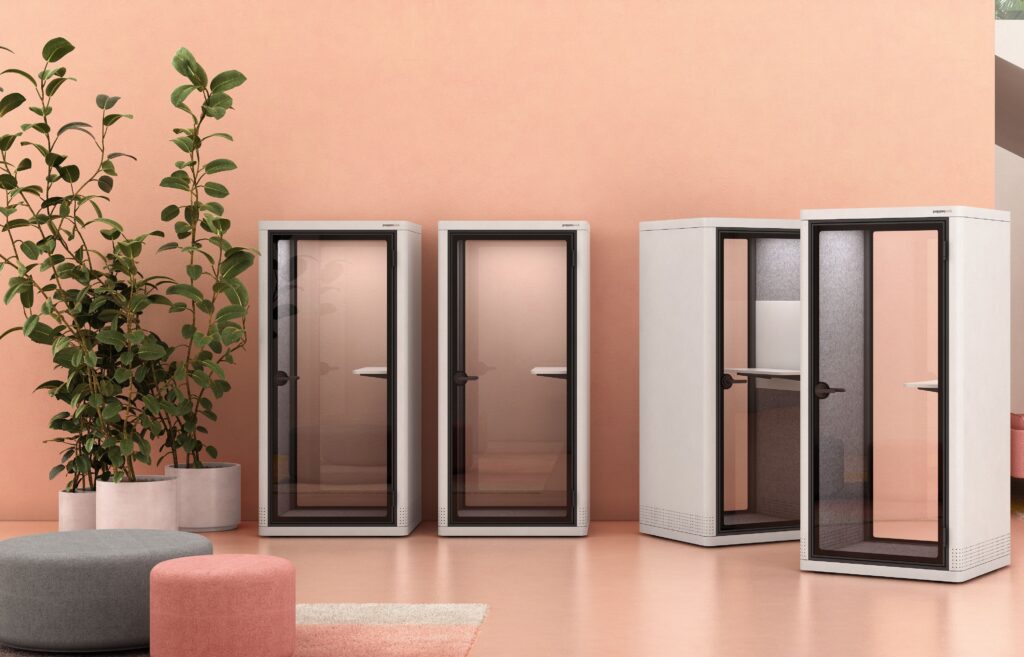 Om pods four of them in white against peach-colored wall