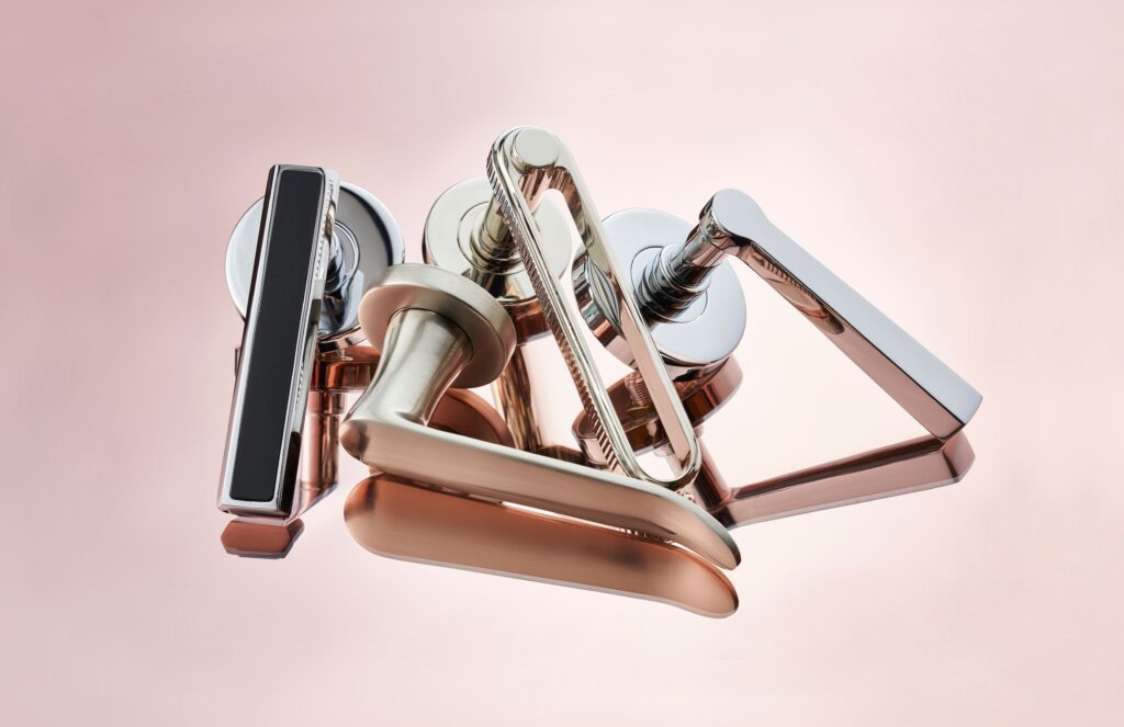 Door hardware in steel with pinkish hue