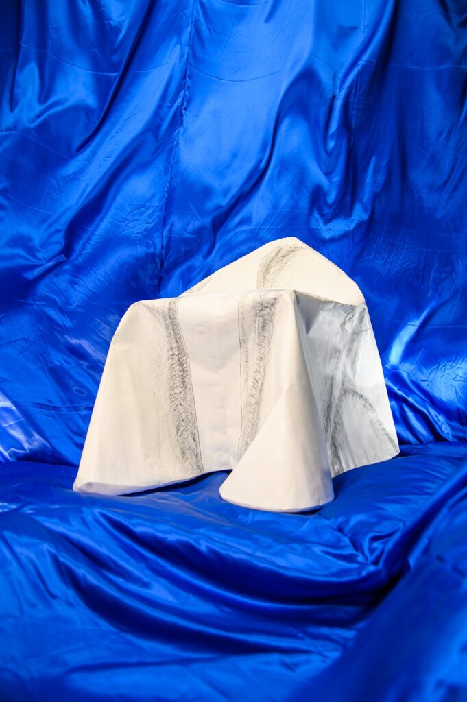 Paper stool on blue background