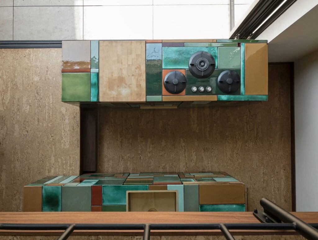 View from above: cooktop with ceramic tiles and countertop/sink