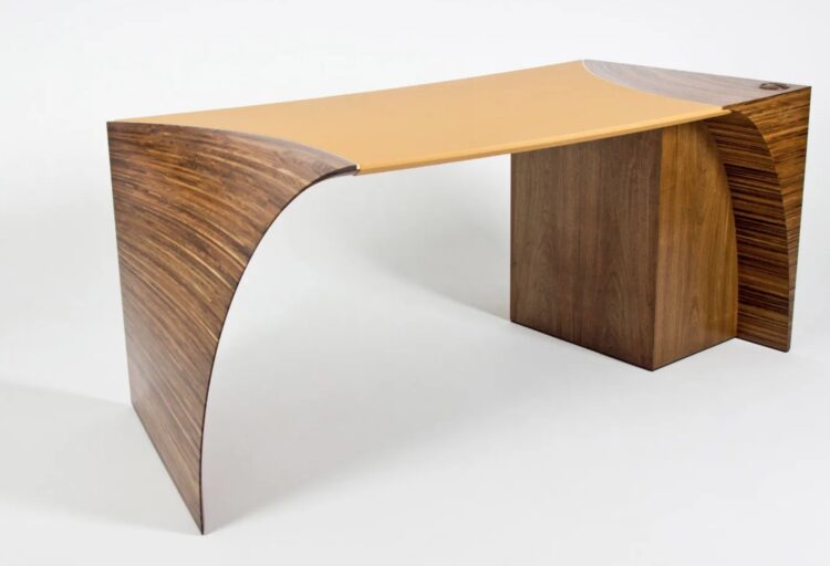 Radium desk angled view medium wood with mustard colo top