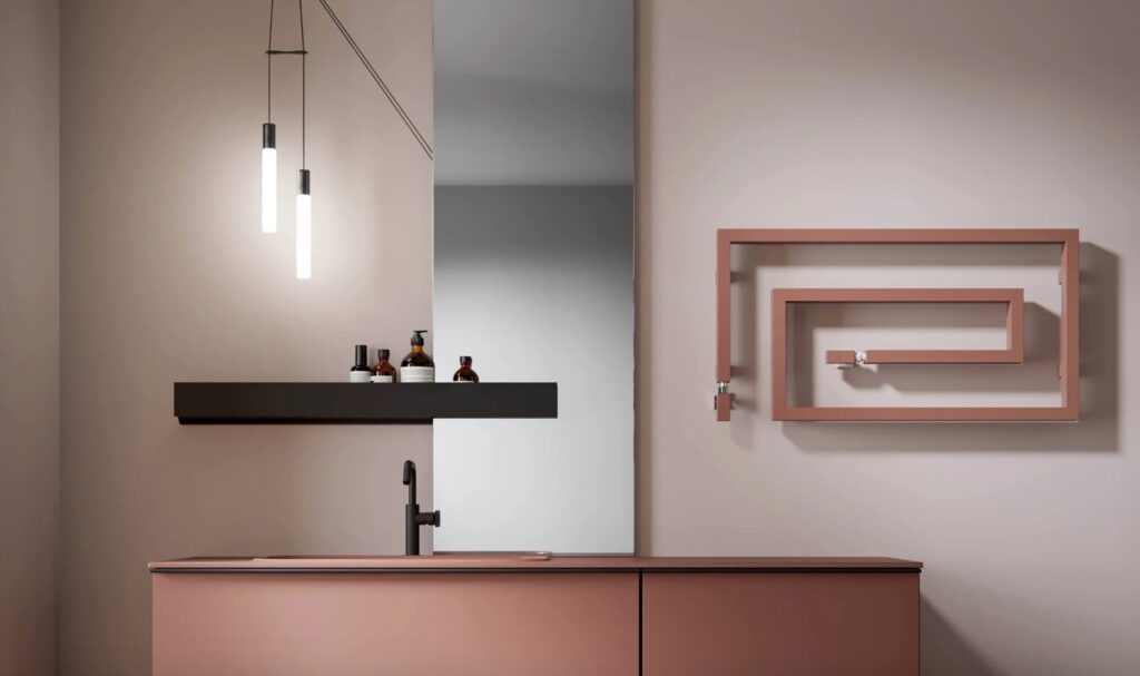 Maze-like towel rail in salmon color on bathroom wall