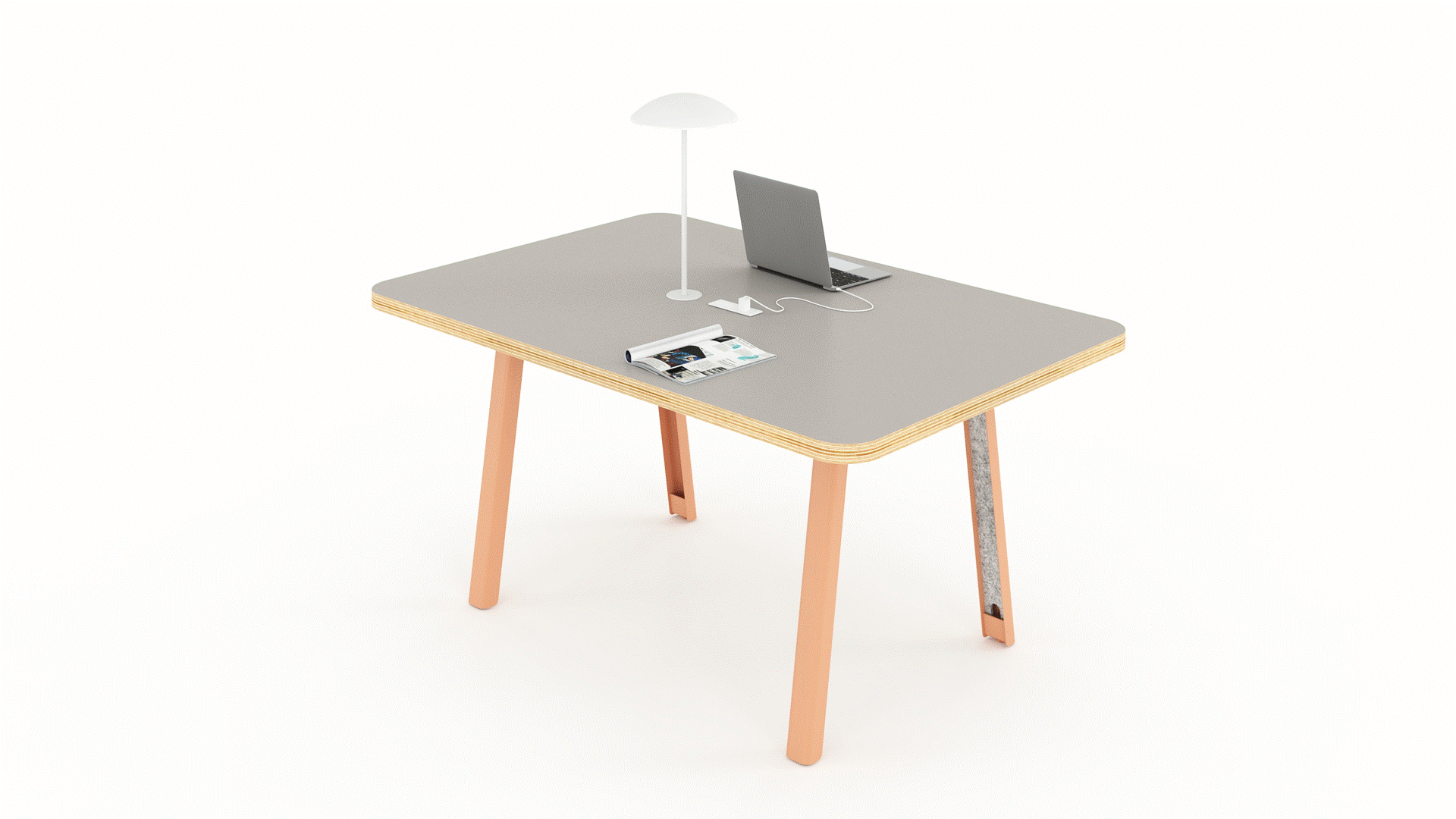 Small table with grey top with laptop and lamp