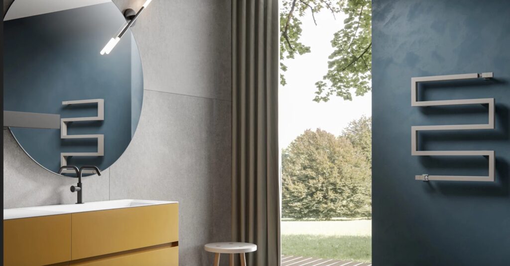 Towel rail in gray on blue wall in bathroom with view of outdoors