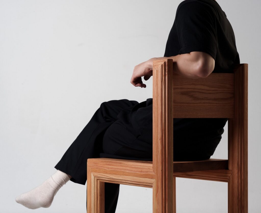 Back of chair with person sitting in it