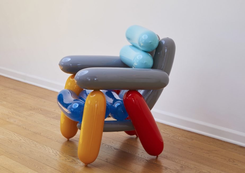 Blowing Series chair with gray, yellow, red, blue. Side view.