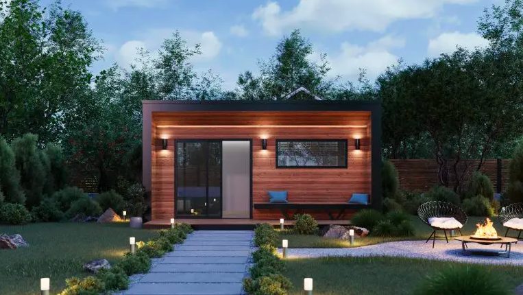 An ADU lit up at night in situ