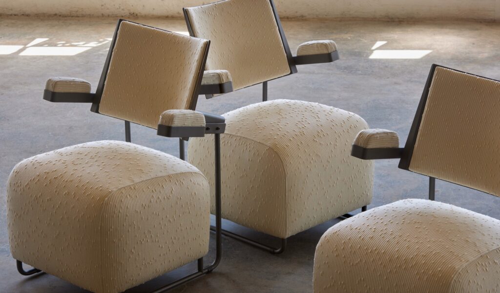 Fabric in white with raised pattern on abstract-style chairs