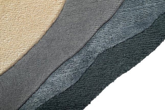 Detail of Boucle rug showing different colors layered