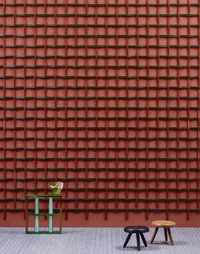 Adagio by Ronan Bouroullec with red and green interlocking ceramics on red wall