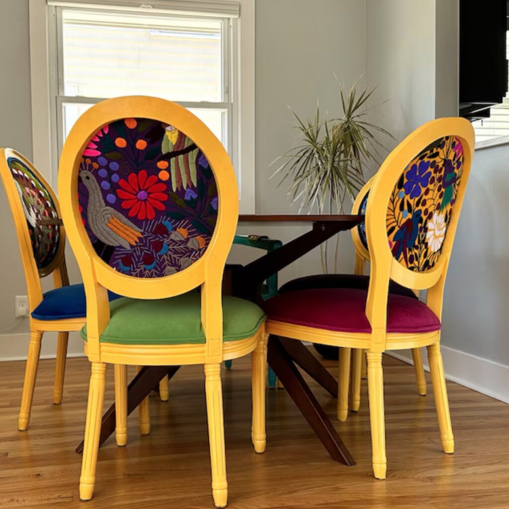 Cheeky Chairs kitchen chairs with bird-themed upholstery on inset back
