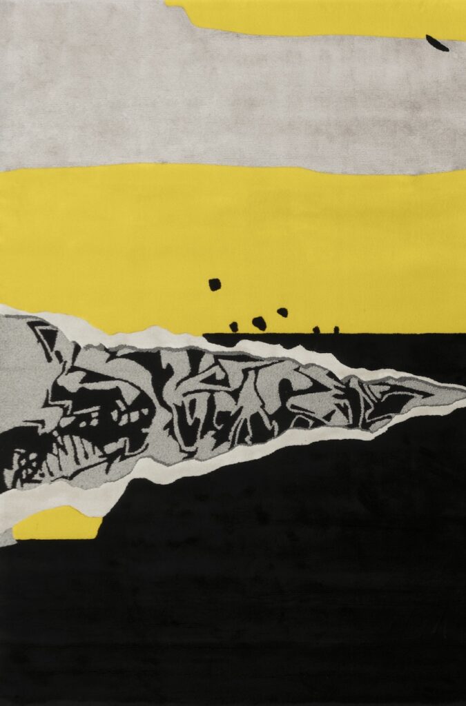 rug with yellow and black and gray swaths with boring device