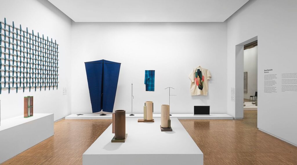 View of exhibit with Issey Miyake garments