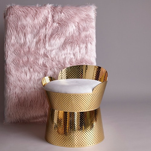 Juliette Chair in situ with a velour-like backdrop