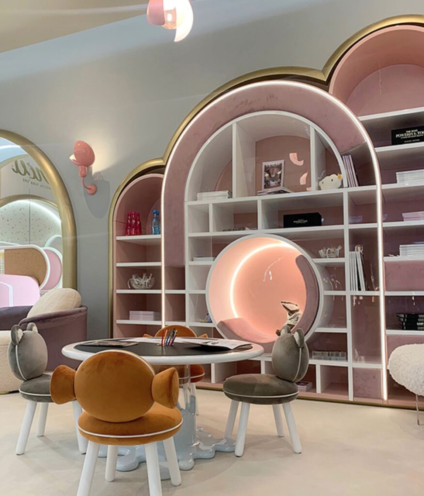 Circu at Salone with table, animal chairs, and circular seating niche with badger