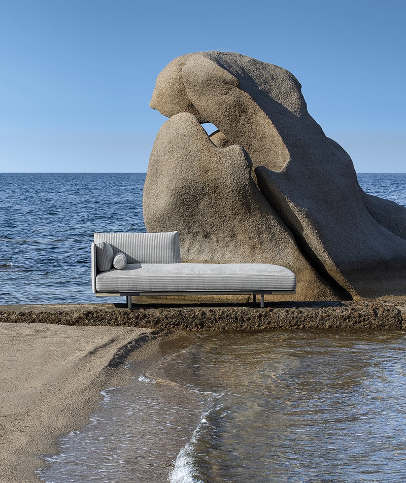 Baia day bed on rocky outcropping near sea