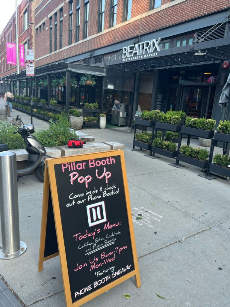 Sign on street outside Pillar Booth Pop Up