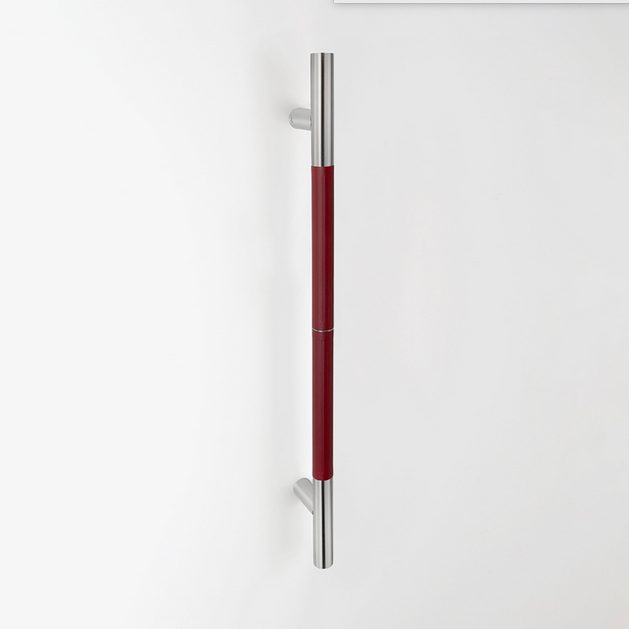 A dark red TOCCO door pull.