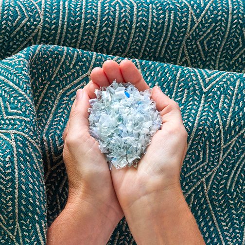 Sea Change textile from CF Stinson with hands holding microplastics