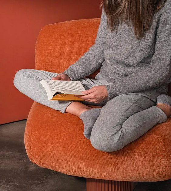 Woman reading on Bolete Lounge BIO