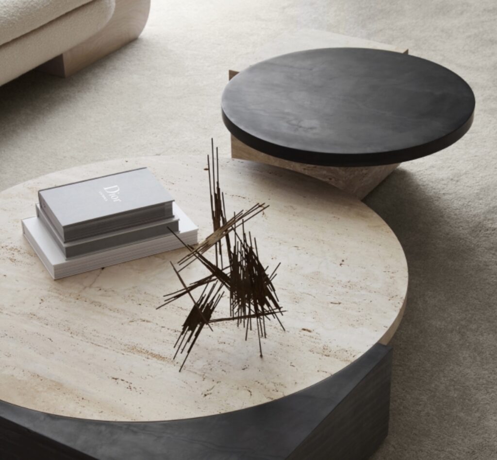 Tribeca tables side by side with books and an unusual wire sculpture on one table