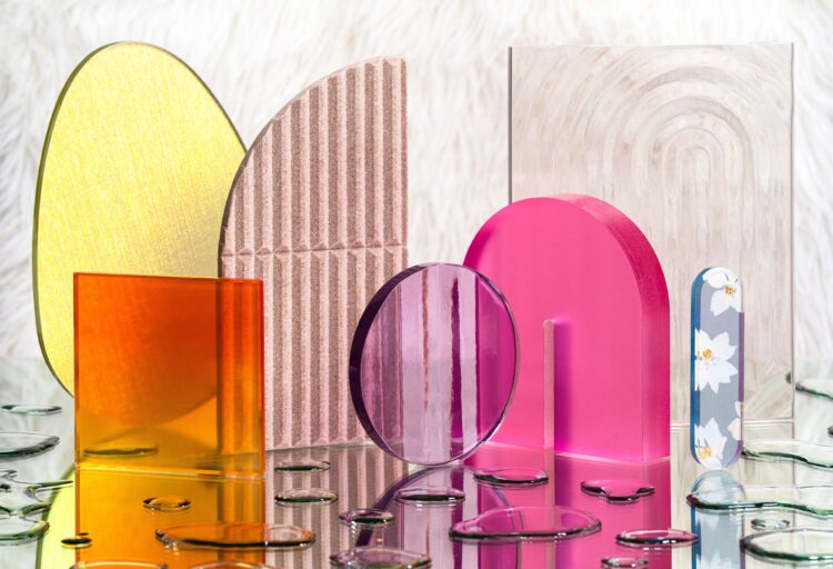 Dreamscape Collection displayed on mirrors with metallic water droplet effect beneath