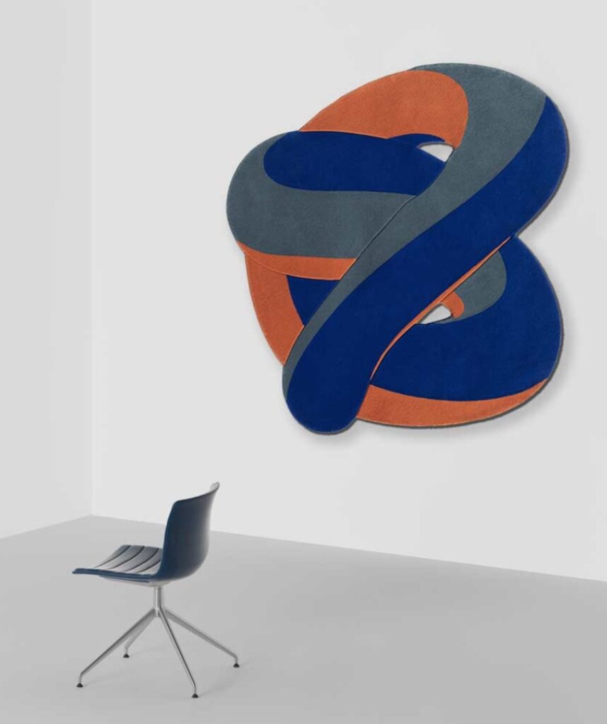 Flux collection blue and salmon color on wall with chair