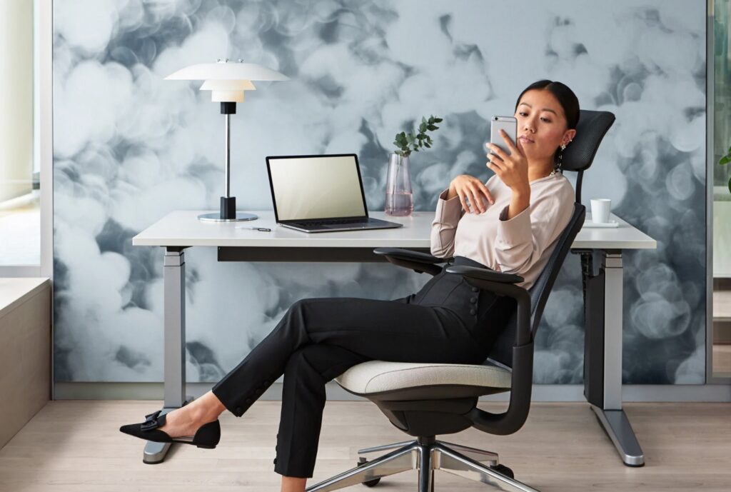 Woman working at Ology desk