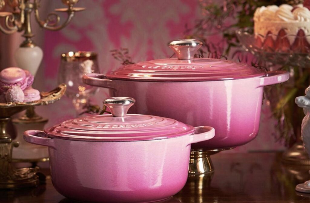 Le Creuset Signature Round Dutch Oven in Berry among pink desserts