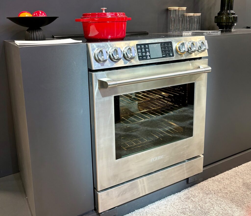 Fotile Stainless with red dutch over on cooktop