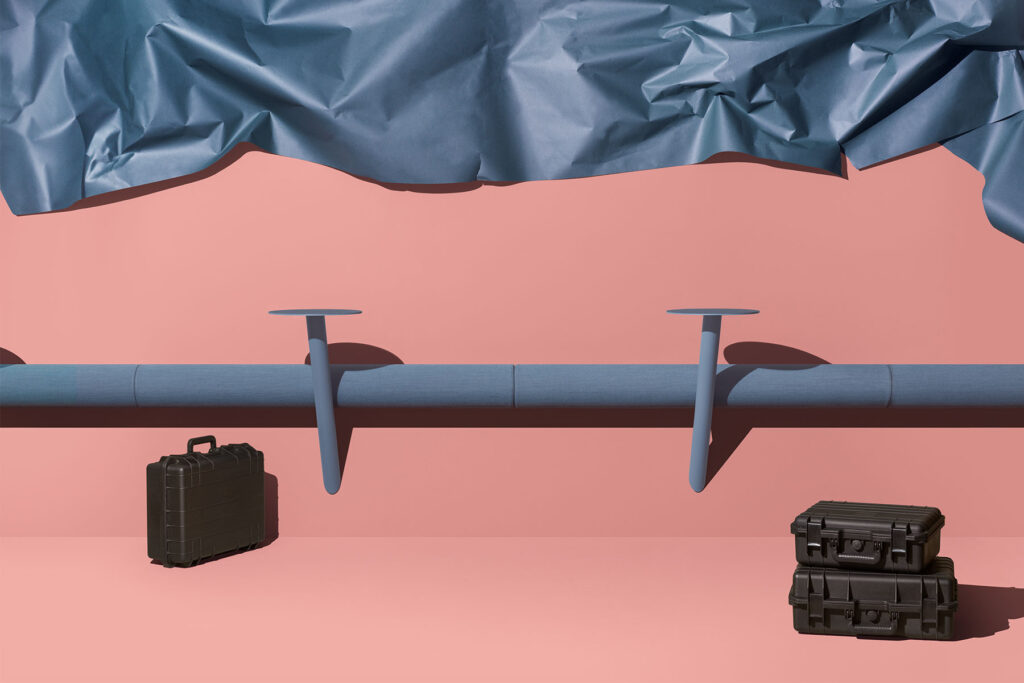 Wall version in blue with black luggage and pink background