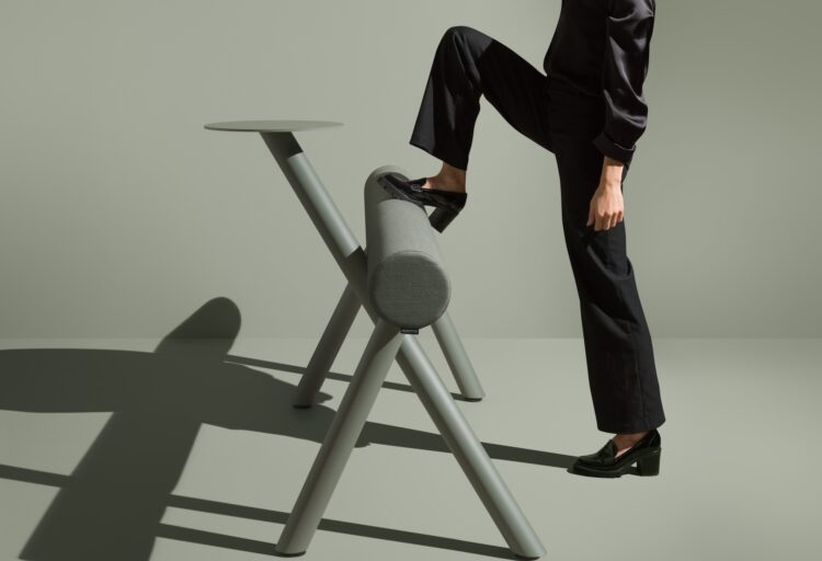 Woman putting leg up on green lumber